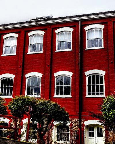 Red-painted historic woolen mill buildings at the Willamette Heritage Center in Salem