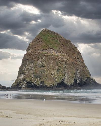 Haystack Rock under clouds at Cannon Beach, Oregon