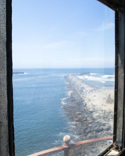 View from the Coquille River Lighthouse over the jetty and Pacific surf at Bullards Beach