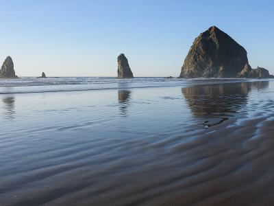 Haystack Rock rising from the beach at Cannon Beach, Oregon